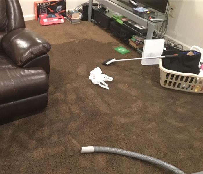 Basement with soaked carpet 